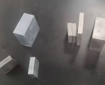 Rare earth permanent magnet materials